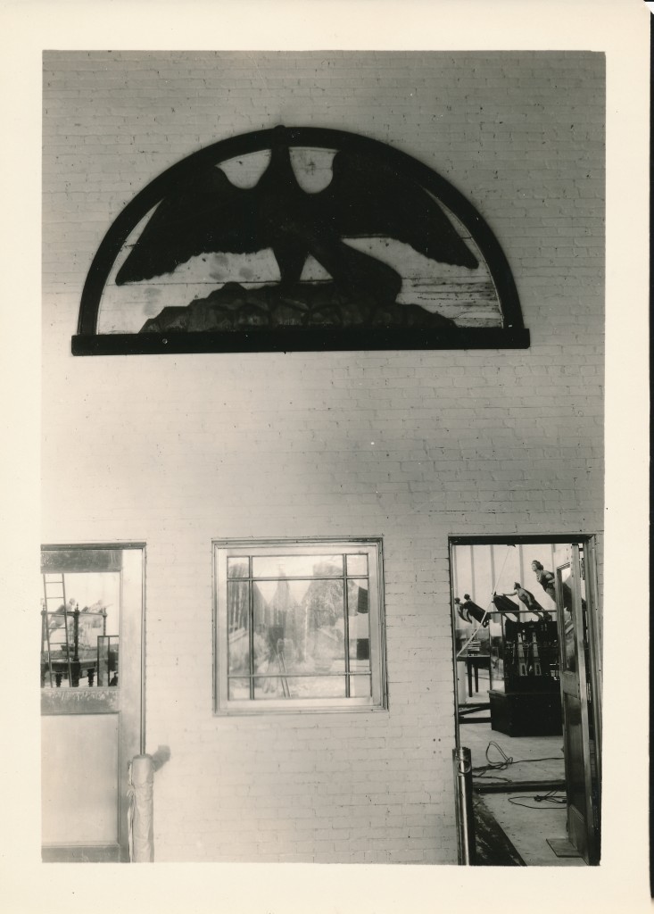 In the lobby, looking through the automatic doors to the gallery