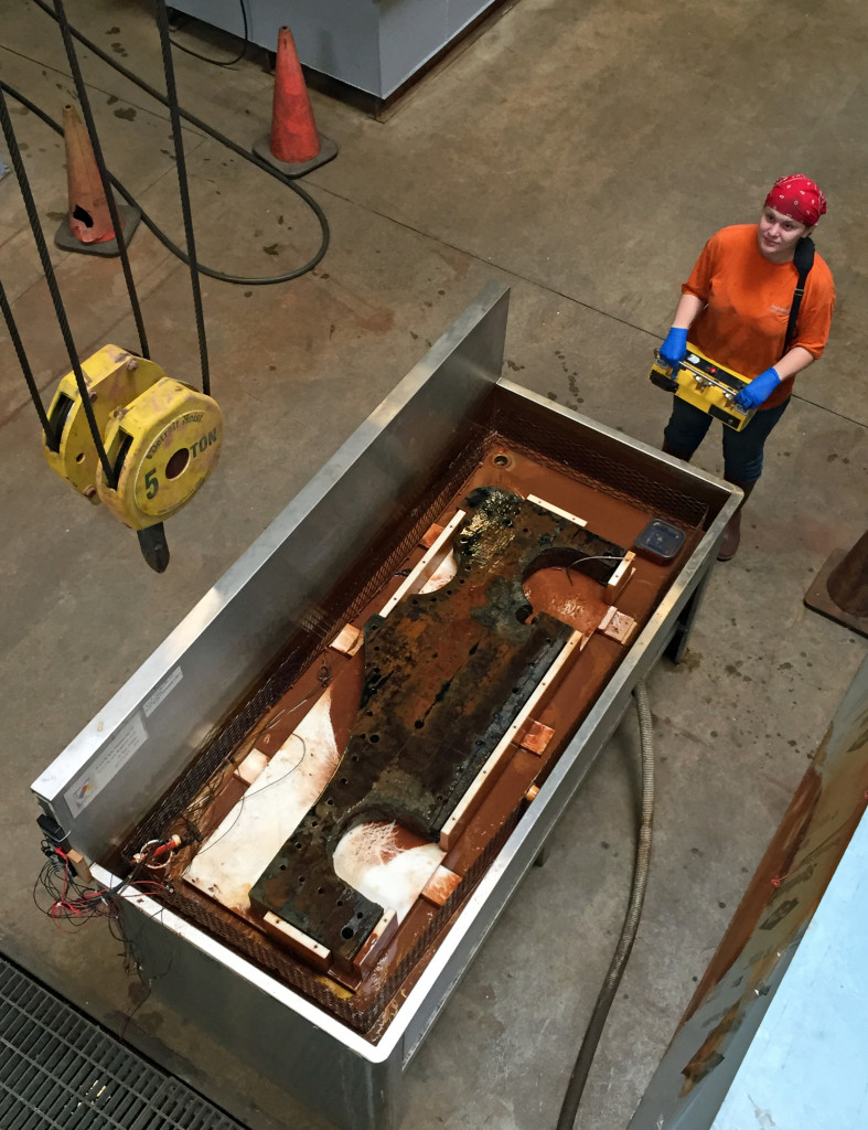 Kate lowering the remote-controlled 5-ton crane hoist.