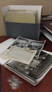 One box of 8 x 10s, with one folder open. Time separated the caption from the back of its print, and you can see how much more fits on a photo of this size than on a 4 x 5.