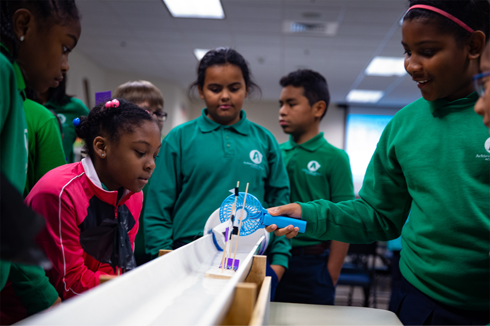 Young students testing a boat design
